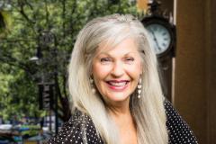 Della Carmichael Headshot with city background
