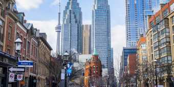 A view of the city skyline and Gooderham & Worts building from the Old Town neighbourhood on Front Street