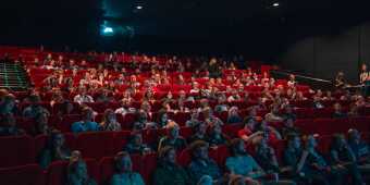 People watching a movie in a movie theatre