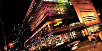 Outside the TIFF Bell Lightbox theatre at night on King Street West