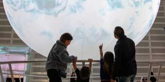 A family explores the exhibits at the Ontario Science Centre.