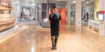 A person standing within the Royal Ontario Museum's Indigenous Art Collection