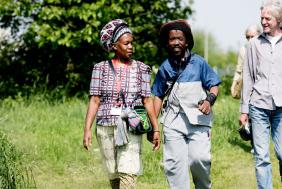 A group of people walking in a field as part of Bristol Walkfest - credit Jeni Nott