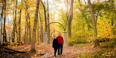 A couple enjoys the colorful fall foliage at Rose Island in Charlestown State Park near Borden, Indiana.