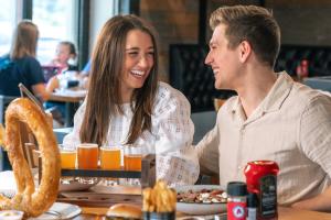 Couple enjoying beer and food at Grateful Goat