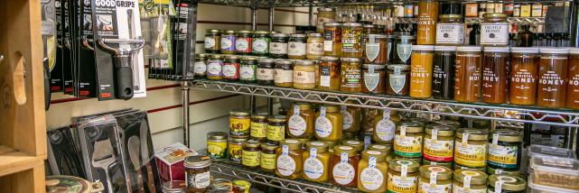A display of cooking utensils, jams, and honey at Goods for Cooks