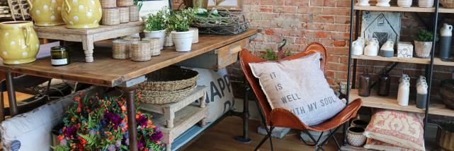 Display of home accents and clothing at Lola + Co.