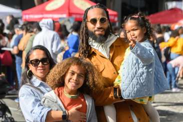 Family in Oakland enjoying the Black Joy Parade with their kids