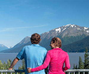 Couple viewing the mountains and inlet on a Turnagain Arm tour