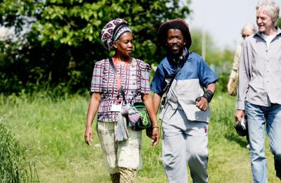 A group of people walking in a field as part of Bristol Walkfest - credit Jeni Nott