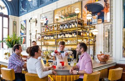 Couple at bar in The Ivy Clifton Village in Clifton, West Bristol - credit The Ivy Collection