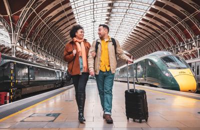2 people with luggage on the platform at Paddington Train Station - Credit Great Western Railway