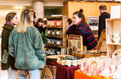 A market trader and 2 customers at the Made in Bristol gift fair - credit Jo Hounsome