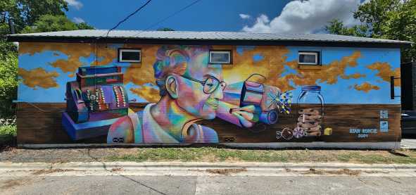 A parking lot view of Ms Ollie's Mural in the Dunbar neighborhood in San Marcos, Texas