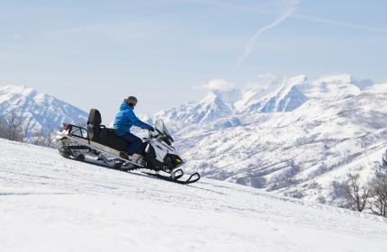 Snowmobile on Ridge with Timpanogos in the background