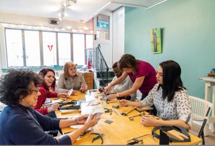 Group enjoys jewelry making class at The Watchmaker's Daughter