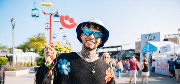 man smiling in a flower setting