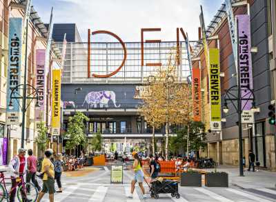People walking outside the Denver Pavilions on the 16th Street pedestrian promenade.