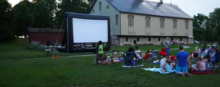 outdoor movie being enjoyed by community
