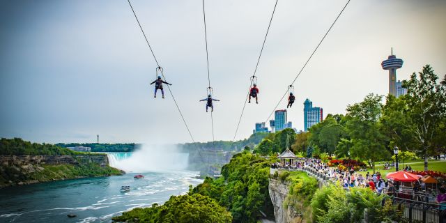 With four parallel ziplines facing the American Falls and the mighty Canadian Horseshoe Falls, riders dangle from a thrilling 67 metres (220 feet) high above the Niagara River at the WildPlay Zipline