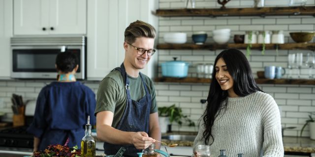 A couple attends a cooking class
