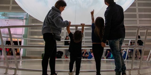 A family explores the exhibits at the Ontario Science Centre.