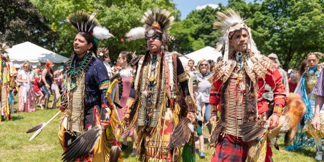 Elders dressed in traditional clothing at the Indigenous Arts Festival at Fort York in Toronto
