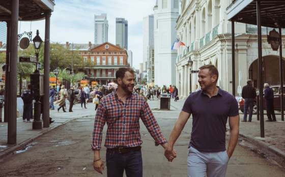 LGBTQ couple exploring New Orleans' French Quarter