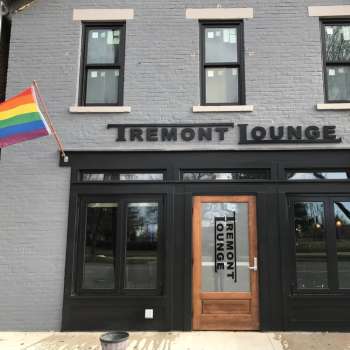 Entrance of Tremont Lounge with Pride flags hanging