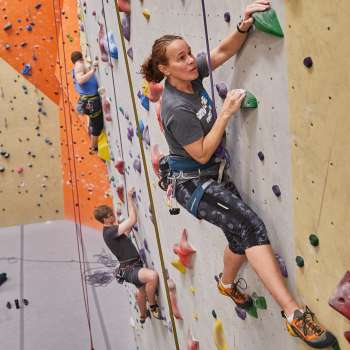 People climbing wall at Vertical Adventures climbing gym