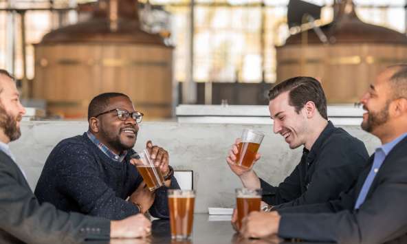 Group of men drinking beer at brewery in Columbia, SC
