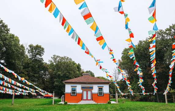 Prayer flags and a building at the Tibetan Mongolian Buddhist Cultural Center