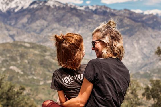 Mom and daughter enjoying scenic mountains