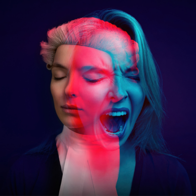 A poster for Prima Facie with two images of Jodie Comer overlapped in pink and blue on a dark blue background.