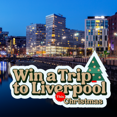 A city backdrop of Liverpool's waterfront at night with a logo that says 'Win a trip to Liverpool This Christmas'