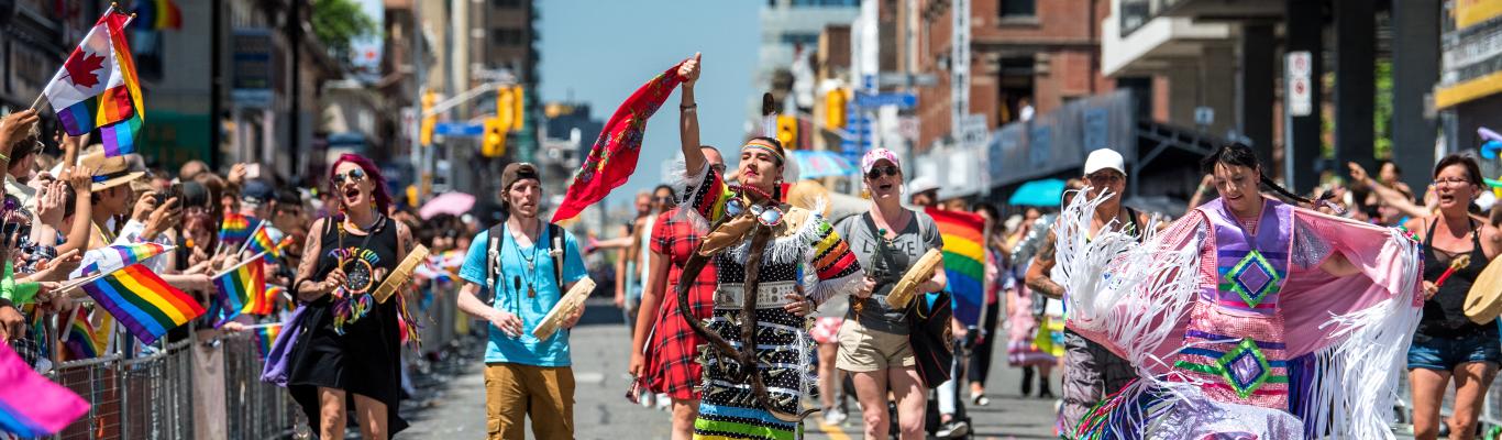 People from Toronto's Indigenous community take part in the Toronto Pride festival parade.