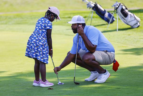 Michael Bradham, APGA Tour professional from Converse, Texas, provides putting pointers to one of the APGA Foundation Youth Clinic participants Sunday at The Club at Shannondell in Audubon.  (Photo credit: Dylan Eddinger)