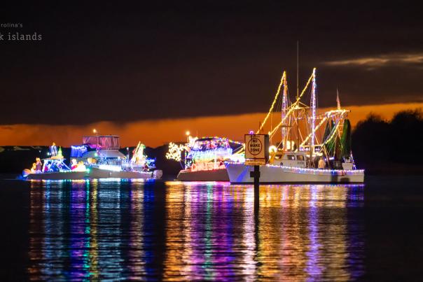 boats decorated with Christmas lights for the 2023 Southport Winterfest flotilla