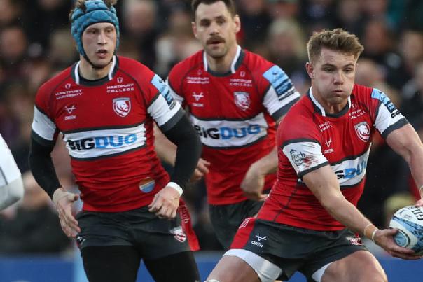 Gloucester Rugby team playing rugby.