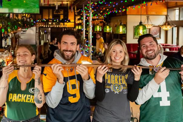 Friends doing a shotski in Buckatabon Tavern