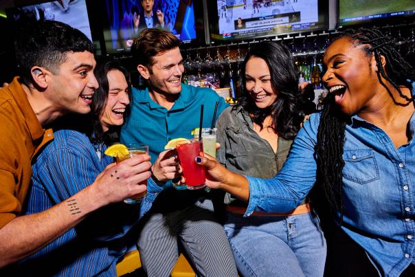 Friends at bar at Topgolf