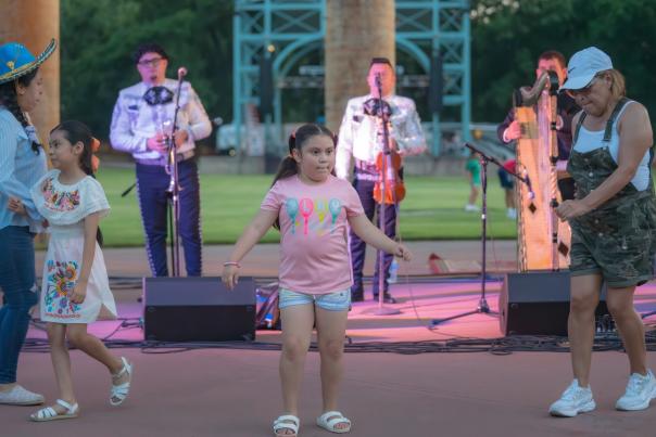 Children dance to Mariachi performance at Levitt Amp in Fort Smith, Arkansas