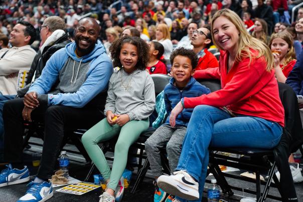 Family smiling on sidelines during Columbus Fury home opener