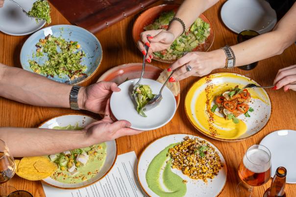 two people enjoy different dishes