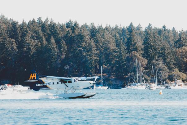 A harbour plane taxiing on the water.