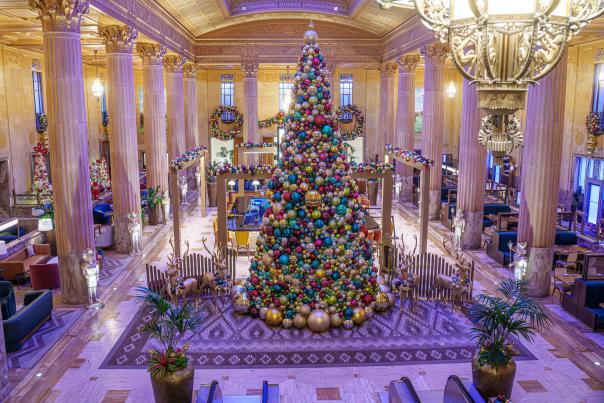 A large Christmas tree at the center of The National hotel