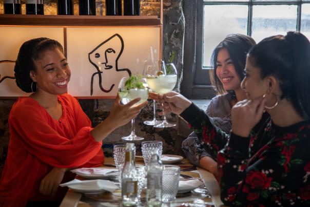 Friends enjoy the Winterlicious menu at modern Spanish tapas bar and restaurant Madrina, in the Distillery District