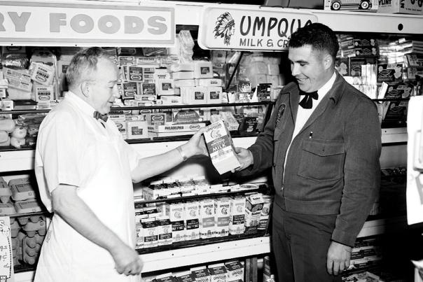 A dairy representative with customer in 1967.