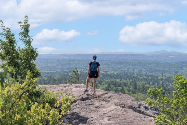 A hiker at Sugarloaf Mountain, Marquette, located in the Upper Peninsula of Michigan
