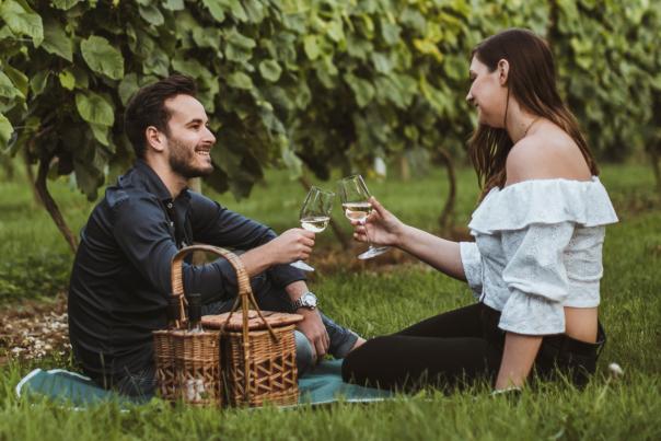 Couple having a picnic at Little Wold Vineyard in South Cave, East Yorkshire